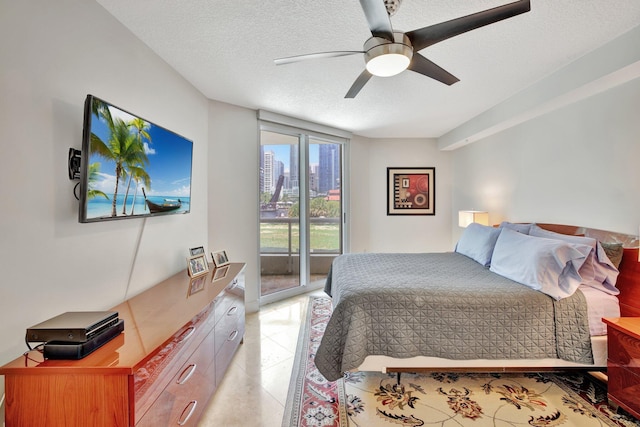 bedroom with ceiling fan, a textured ceiling, access to outside, and light tile floors