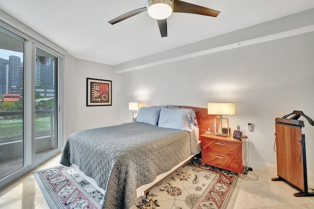 bedroom with ceiling fan and access to exterior