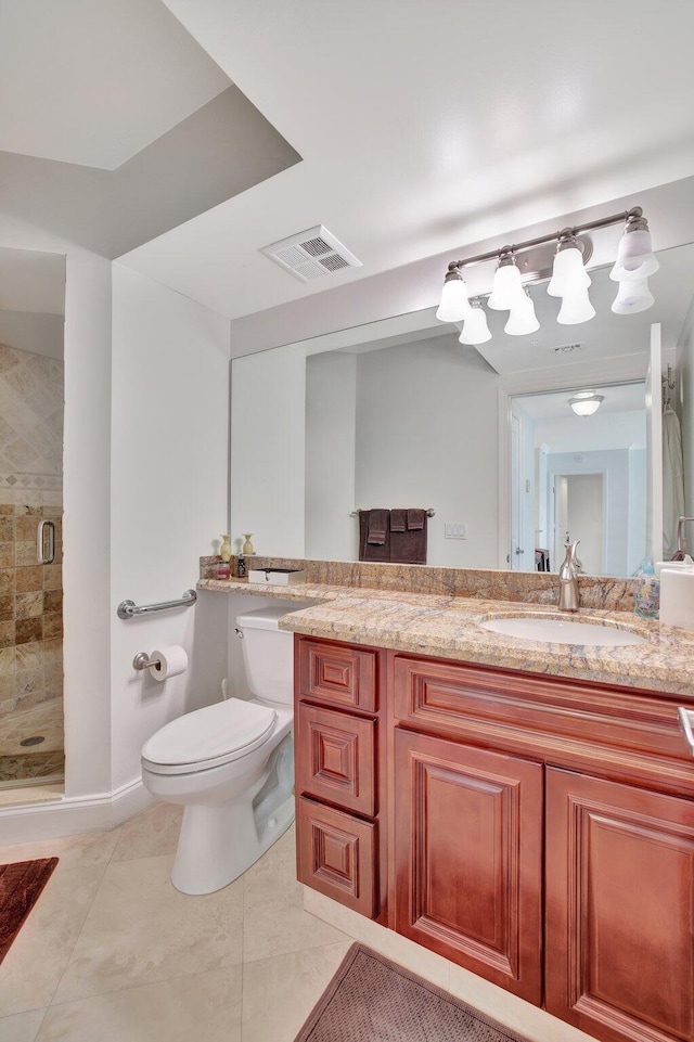 bathroom with an enclosed shower, oversized vanity, toilet, and tile floors