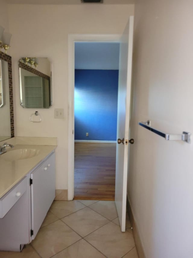 bathroom with hardwood / wood-style flooring and vanity