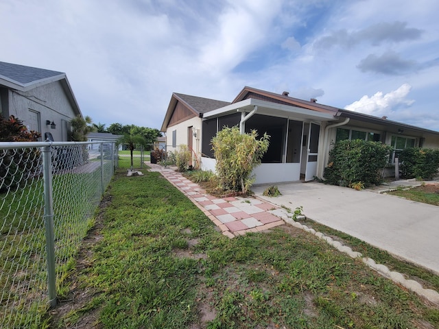 view of home's exterior featuring a lawn