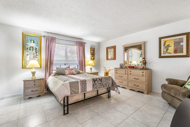 bedroom with a textured ceiling, light tile patterned flooring, and multiple windows
