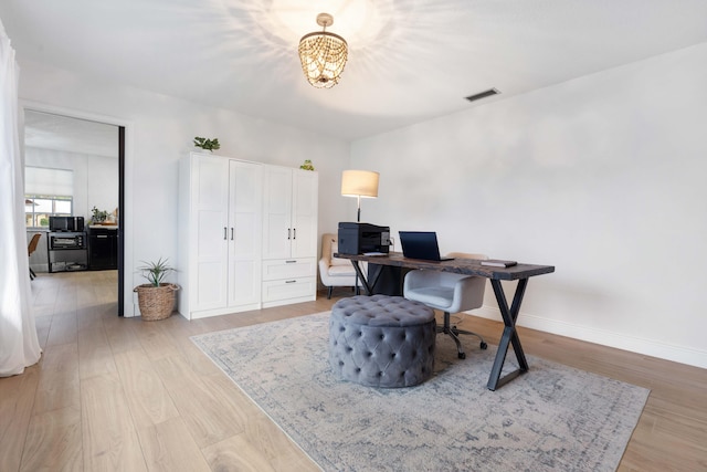 office space featuring light hardwood / wood-style floors