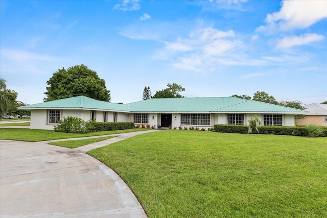 ranch-style home featuring a front yard