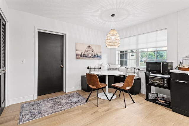 dining area featuring light hardwood / wood-style floors and breakfast area