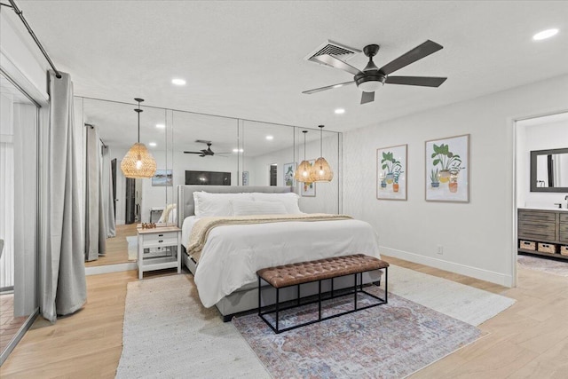 bedroom featuring ceiling fan and light hardwood / wood-style flooring