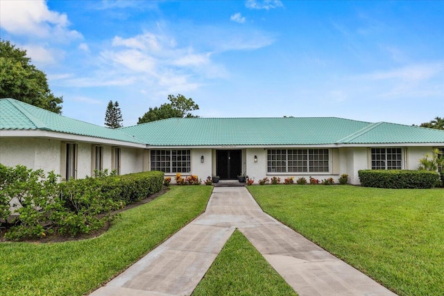 ranch-style home featuring a front yard