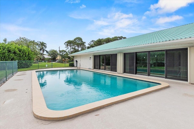 view of pool featuring a patio