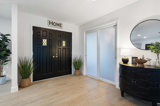 entrance foyer with light hardwood / wood-style flooring