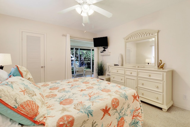 bedroom with ceiling fan, a closet, and light colored carpet