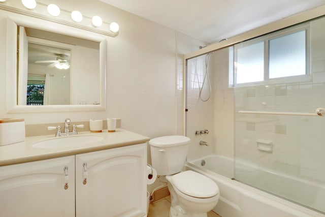 full bathroom featuring toilet, bath / shower combo with glass door, vanity, and ceiling fan