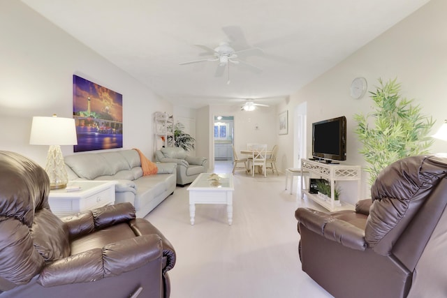 living room featuring light carpet and ceiling fan