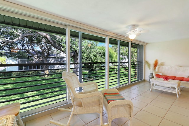 sunroom featuring ceiling fan