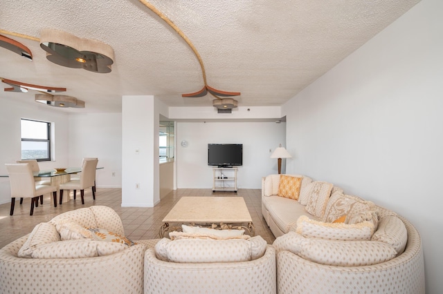 living area with a textured ceiling