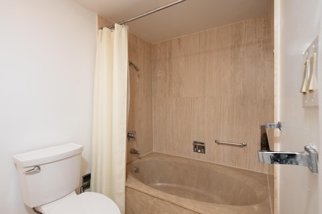 bathroom with shower / bath combo and toilet