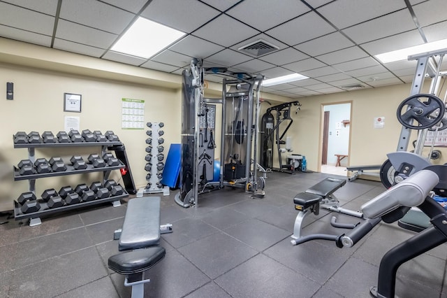 workout area with visible vents and a drop ceiling