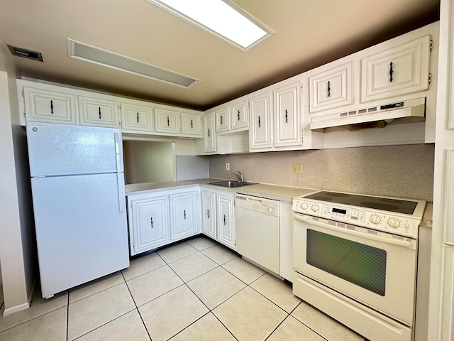 kitchen with sink, white cabinetry, white appliances, and light tile floors