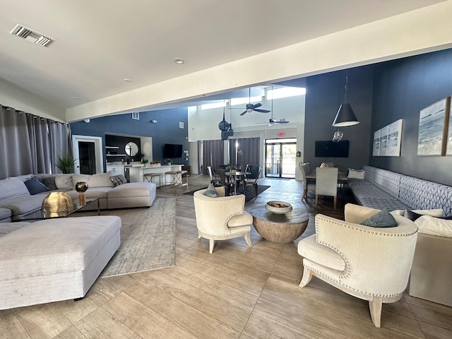 living room featuring hardwood / wood-style flooring and ceiling fan