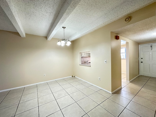 unfurnished room with beamed ceiling, a notable chandelier, a textured ceiling, and light tile floors