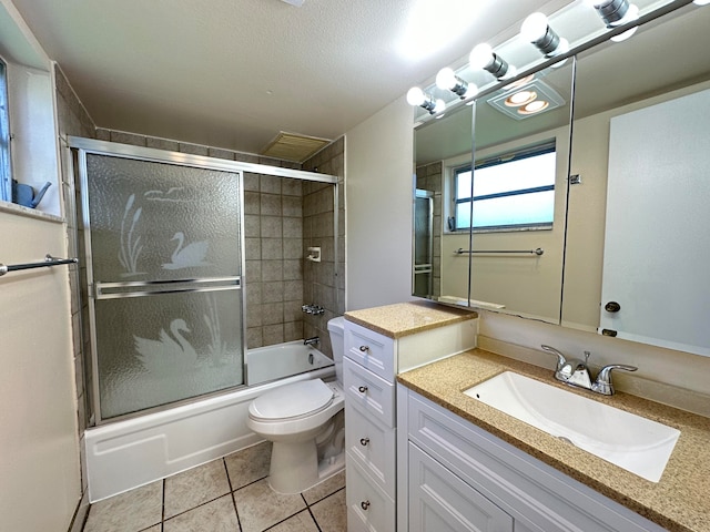 full bathroom featuring shower / bath combination with glass door, a textured ceiling, tile floors, toilet, and vanity