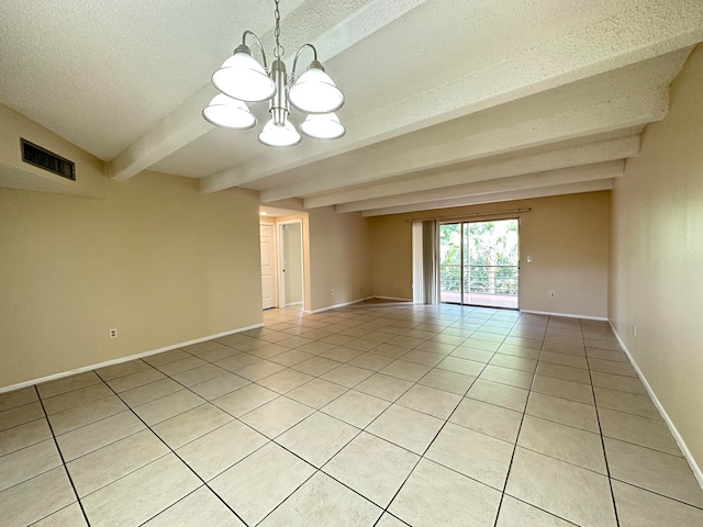 tiled empty room featuring beam ceiling, an inviting chandelier, and a textured ceiling