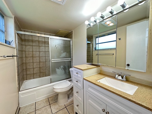 full bathroom featuring tile floors, vanity, toilet, and enclosed tub / shower combo