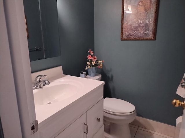 bathroom with vanity, tile patterned floors, and toilet