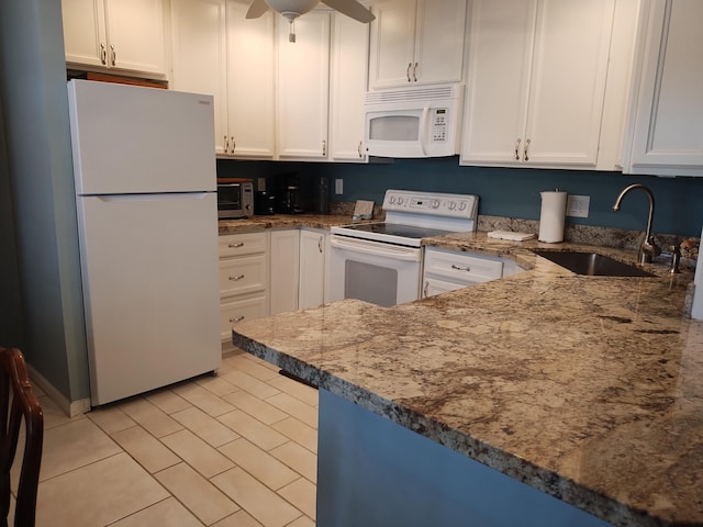 kitchen with white cabinetry, stone countertops, sink, white appliances, and ceiling fan