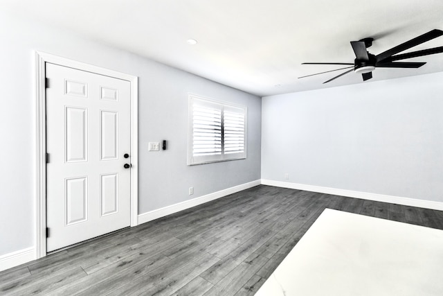 empty room featuring hardwood / wood-style floors and ceiling fan