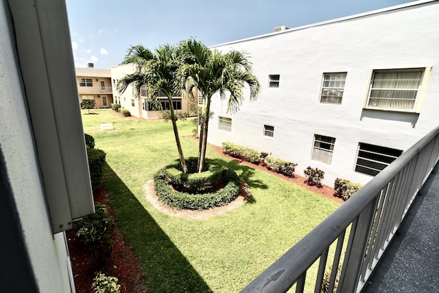 view of yard featuring a balcony