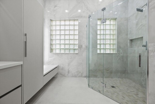 bathroom featuring vanity and walk in shower