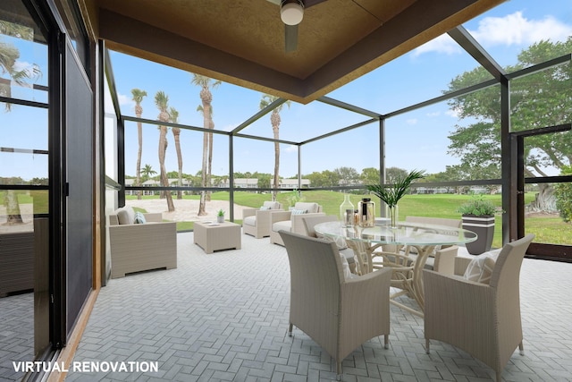 view of patio / terrace featuring a lanai, ceiling fan, and an outdoor hangout area