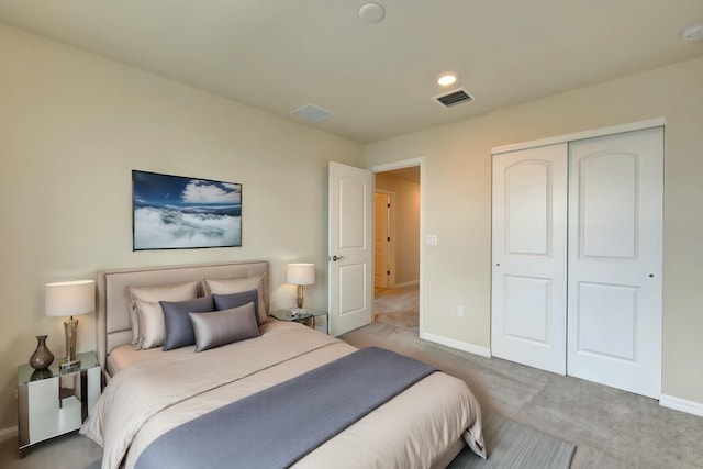 bedroom featuring carpet and a closet