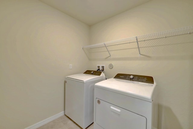 clothes washing area featuring washing machine and dryer