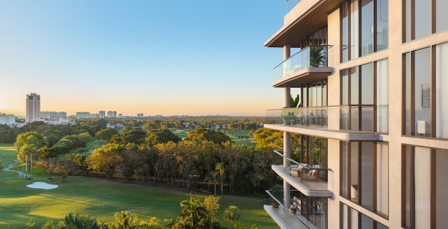 exterior space with a yard and a city view