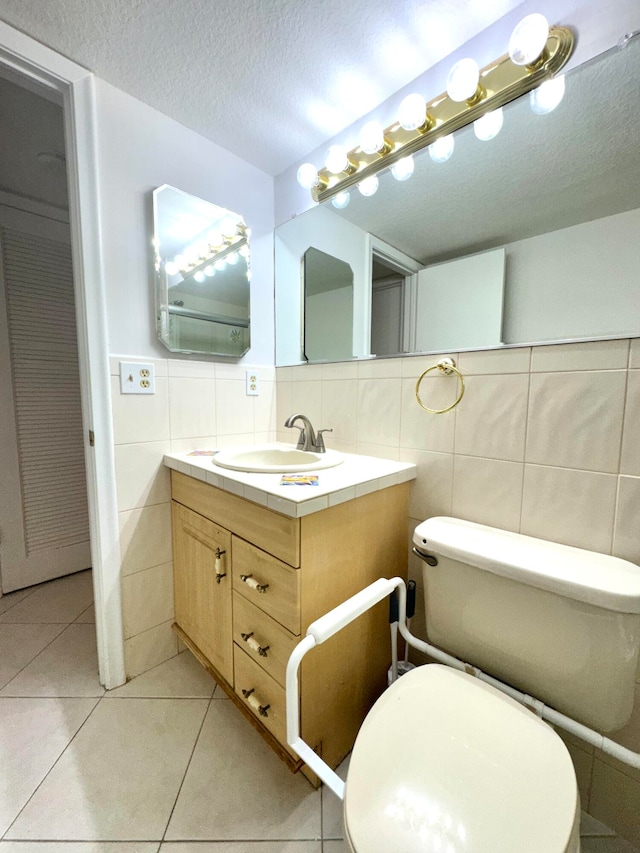 bathroom featuring toilet, tile patterned floors, decorative backsplash, and tile walls