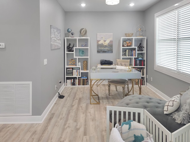 office space with wood-type flooring