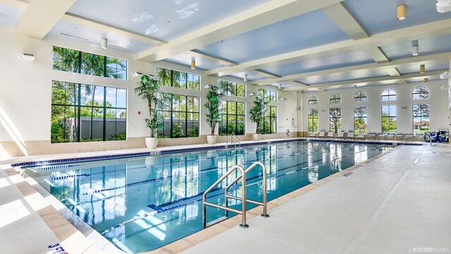 pool at dusk featuring a patio area