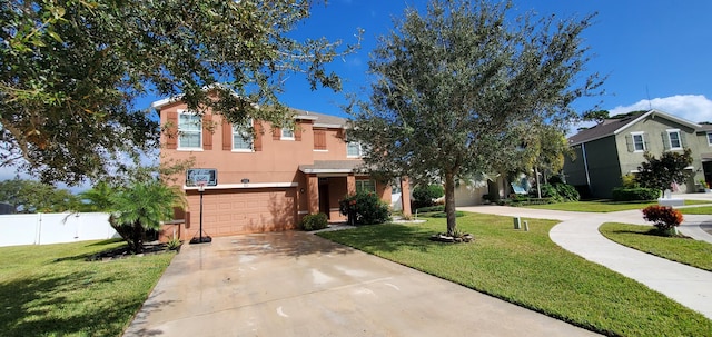 view of front facade with a garage and a front yard