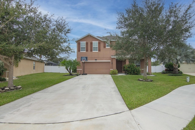 view of front of house with a front yard and a garage