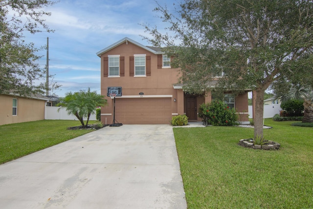 view of front of home with a front lawn and a garage