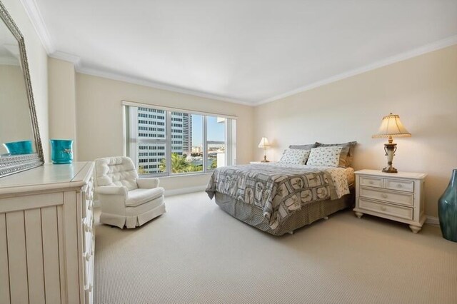 carpeted bedroom featuring ornamental molding