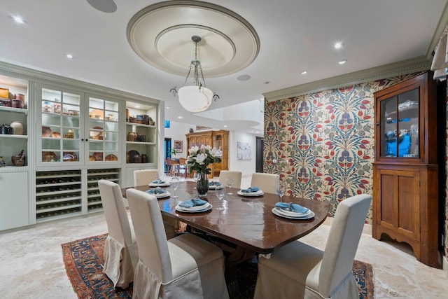 dining room featuring a tray ceiling and built in shelves