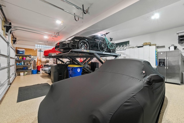 garage featuring stainless steel fridge