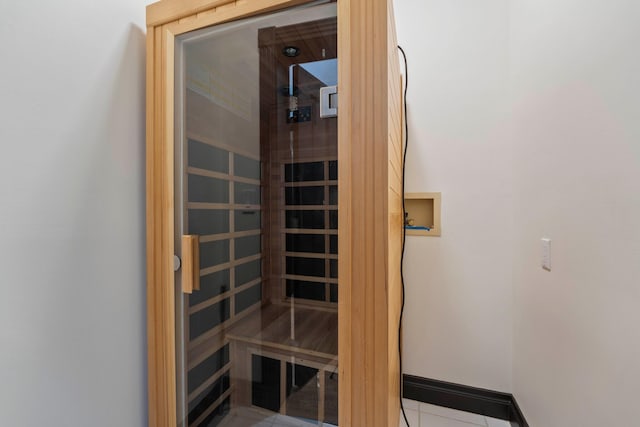 view of sauna / steam room with tile patterned floors