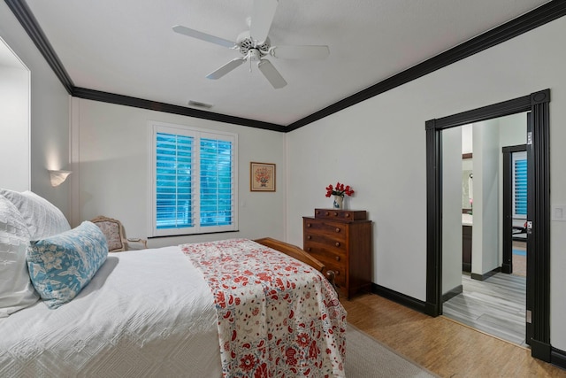 bedroom with ceiling fan, crown molding, and light wood-type flooring