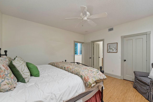 bedroom featuring ceiling fan and light hardwood / wood-style floors