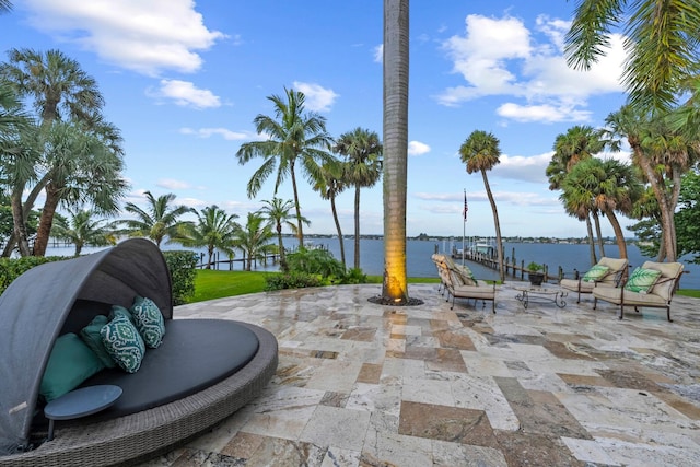 view of patio featuring a boat dock and a water view