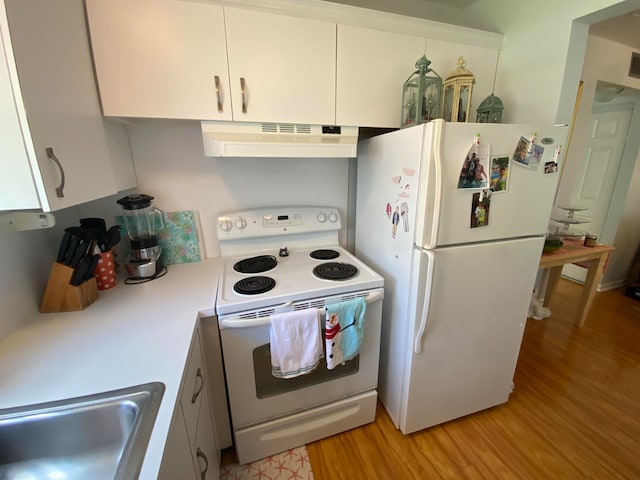 kitchen with white cabinetry, sink, light hardwood / wood-style floors, and white appliances