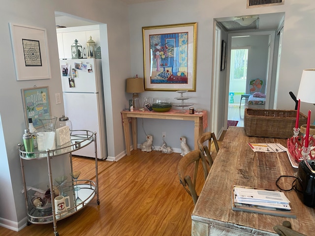 dining area featuring hardwood / wood-style floors